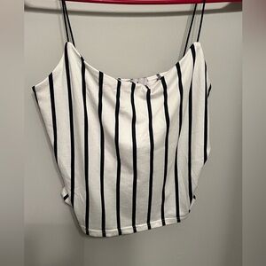 White tank top with black stripes. Nylon black stretch strings